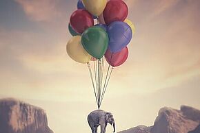 image d'un éléphant qui vole grace à des ballons